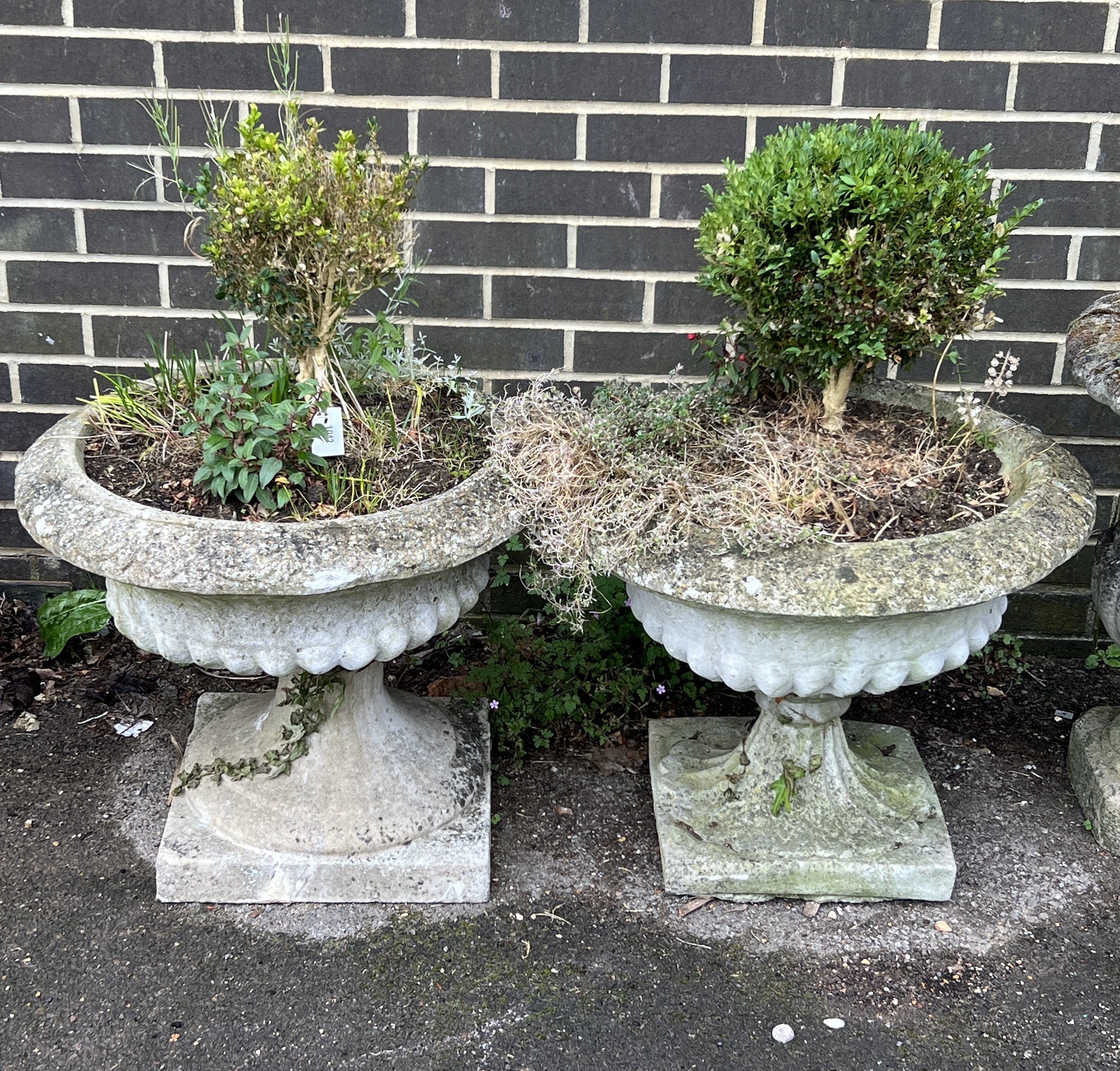 A pair of circular reconstituted stone campana garden urns, diameter 60cm, height 50cm